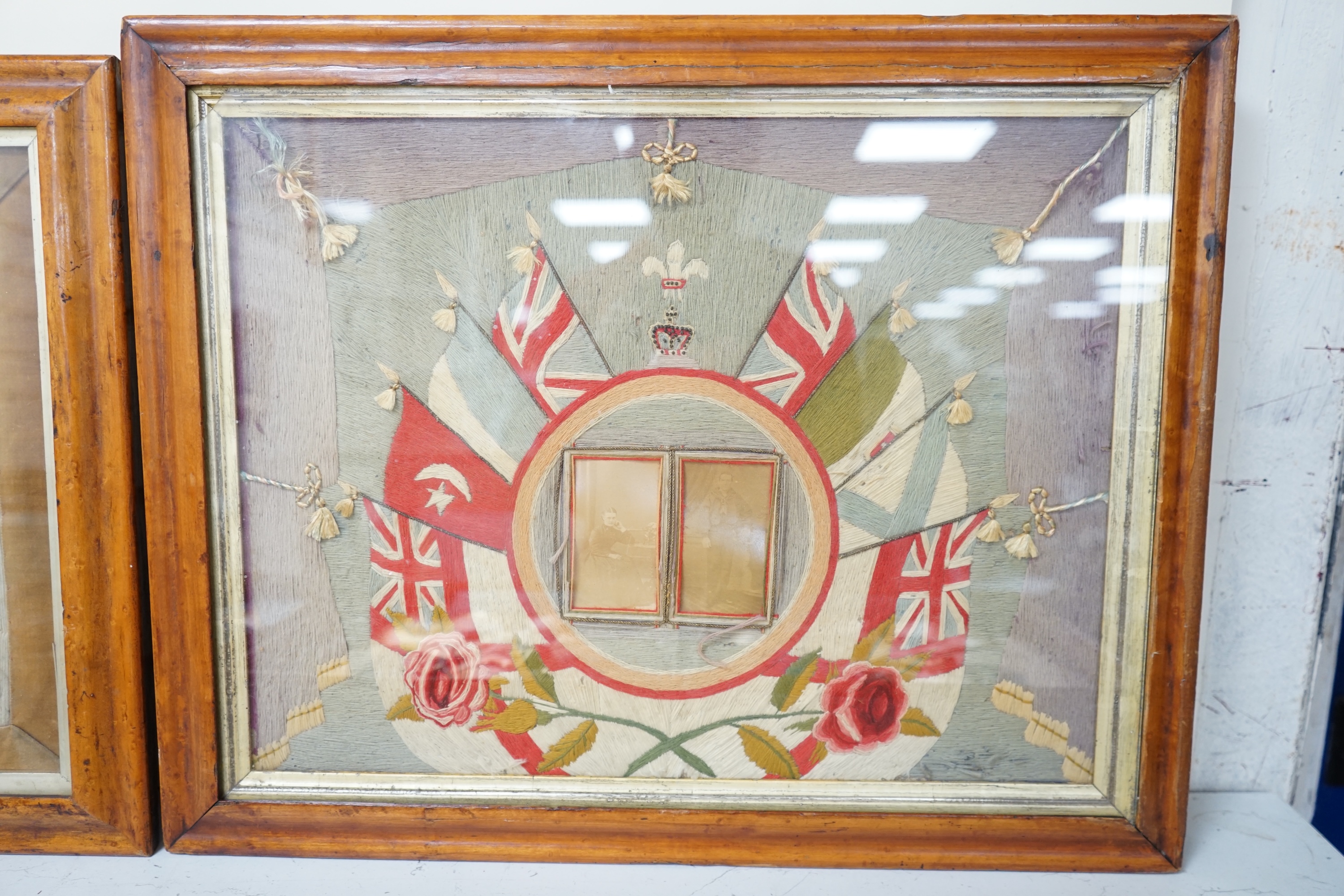 Two early 20th century woolwork panels housing black and white photographs to include soldiers in military dress, maple framed, 42 x 52cm. Condition - fair